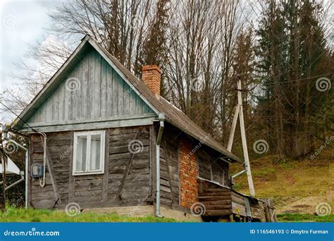 Old Fashioned Wooden House On The Outskirts Of The Forest Among Stock