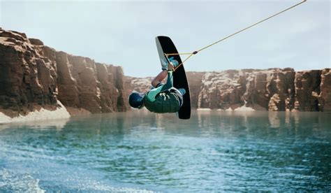 Premium Photo Wakeboarder Making Tricks On The River Wakeboarding