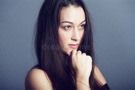 Succumb To Her Seductive Nature A Beautiful Brunette Looking Ahead Of Her In Deep Thought