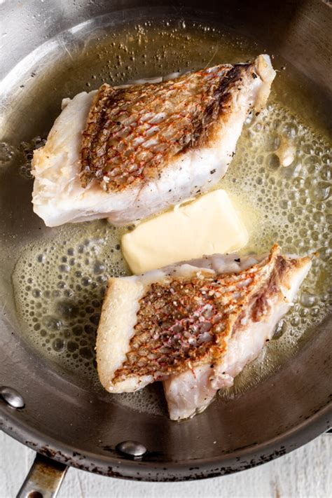 Pan Seared White Fish Cooking With Cocktail Rings