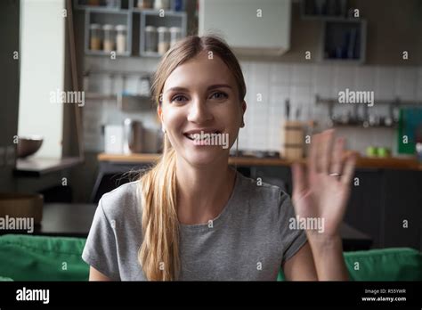 Portrait Happy Smiling Woman Waving Hand Looking At Camera Stock Photo