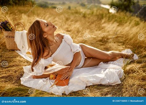 Woman In Lingerie Lying With Book In Field Stock Image Image Of Model Face 234716855