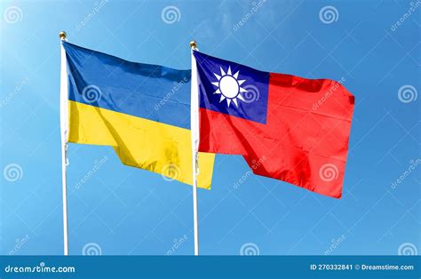 Ukrainian Flag And Taiwan Flag On Cloudy Sky Waving In The Sky Stock