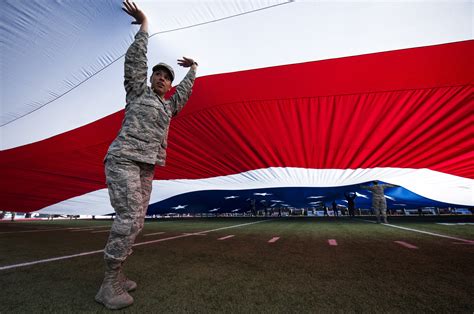 Nellis Creech Airmen Wave Half Ton American Flag For Las Vegas Bowl