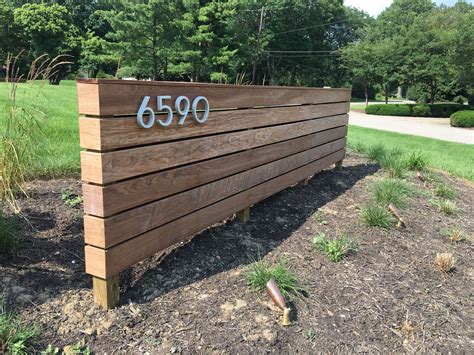 Front Yard Landscaping With A Wooden Sign