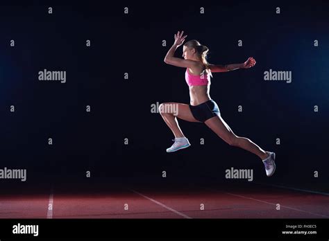 Athletic Woman Running On Track Stock Photo Alamy