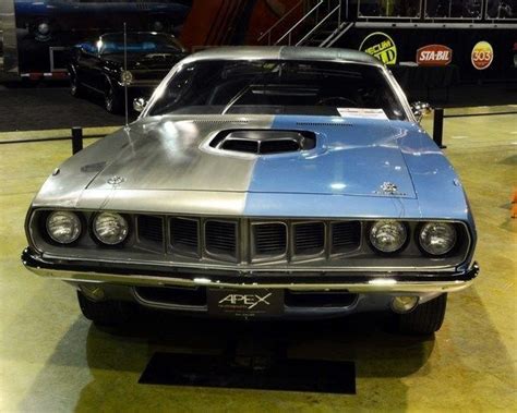 An Old Muscle Car On Display In A Museum