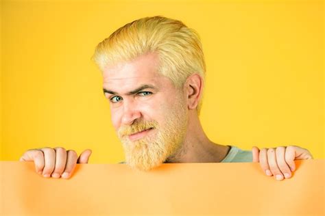 Premium Photo Man Holding A Blank Billboard Isolated On Background