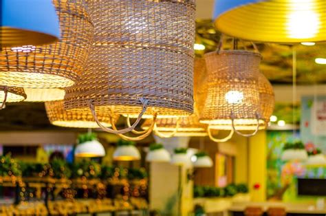 Premium Photo Lamps With Straw Shades On The Ceiling In The Cafe