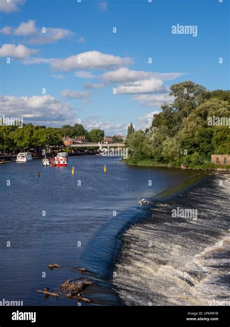 Weir And Tourist Sightseeing Boats On The River Dee Chester Cheshire