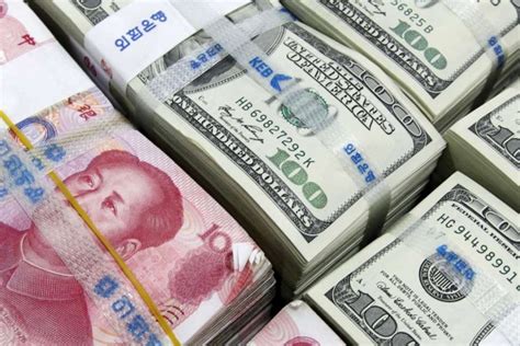 yuan drops  fresh  year   analysts confident pboc  avoid