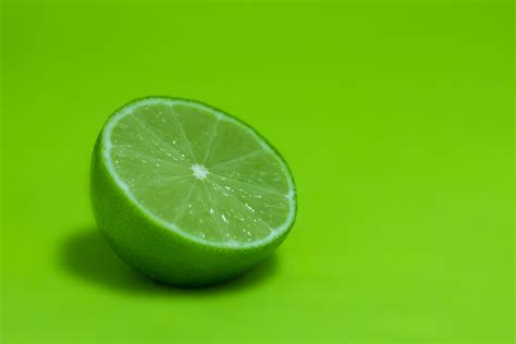 Sliced Green Lime On Wood Hd Wallpaper Wallpaper Flare