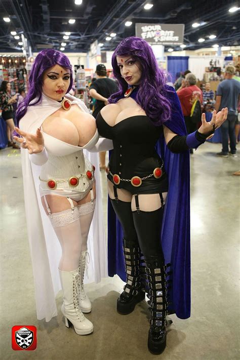 Two Women Dressed In Cosplay Costumes Posing For The Camera At A