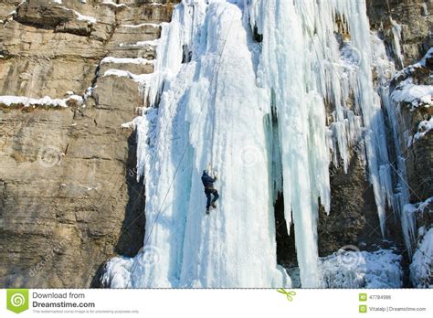 Man Climbing Frozen Waterfall Stock Photo Image Of Climber