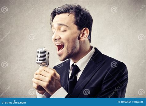 Man Singing Into A Microphone Stock Image Image Of Shout Microphone