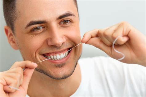 A Step By Step Guide To Flossing With Invisalign