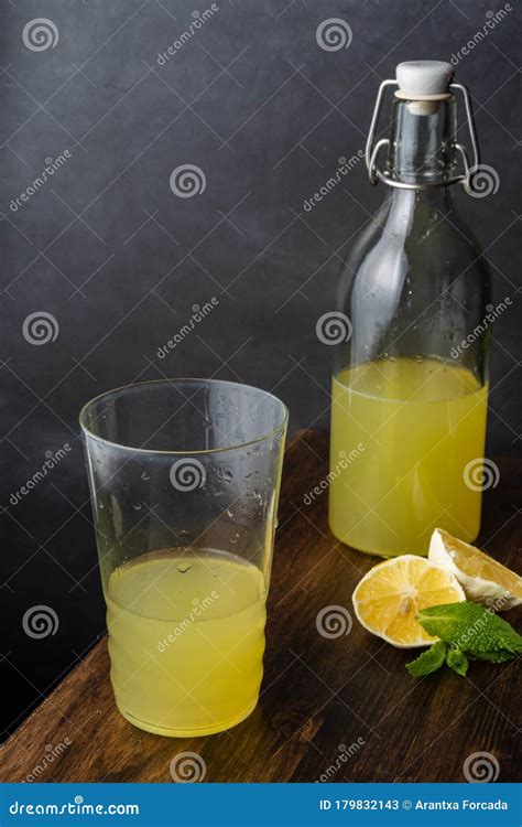 Top View Of Glass And Bottle With Lemonade With Pieces Of Lemon And