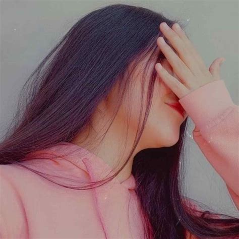 A Woman With Long Hair Covering Her Eyes