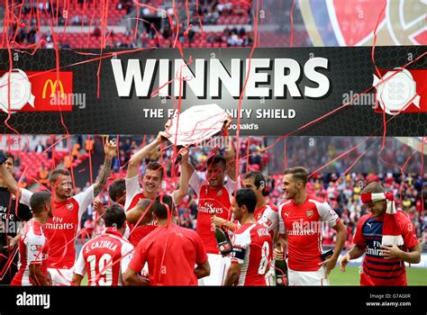 Arsenal players celebrate with the fa community shield trophy hi-res ...