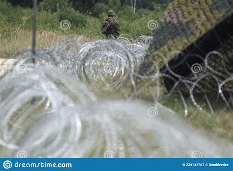 Soldiers of Poland on Border. Polish Soldiers Near a Fence on the Borde ...