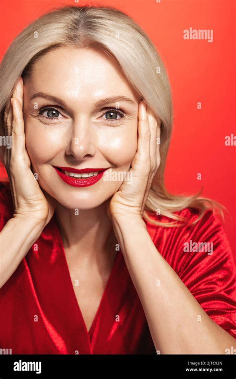 Vertical Shot Of Mature Woman 50 Years Blond Hair And Makeup On Wearing Dress For An Event