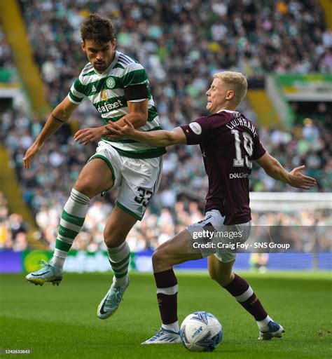 Celtics Matt Oriley And Hearts Alex Cochrane In Action During A