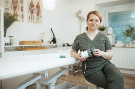 Happy Female Massage Therapist In Massage Cabinet Stock Image Image