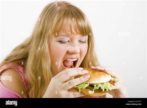 Hungry Blonde And Hamburger Stock Photo Alamy