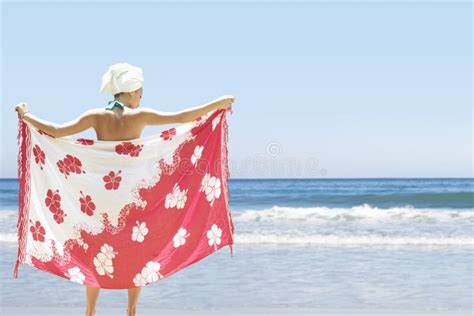 Woman With Sarong On A Windy Beach Stock Photo Image Of Breeze