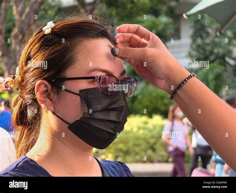 A Female Devotee Receives Ash Marking On Her Forehead Catholic