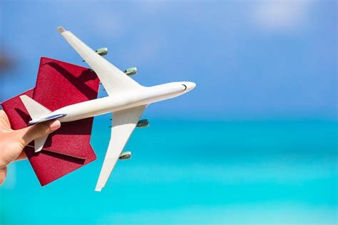 Premium Photo Closeup Of Passports And White Airplane The Sea