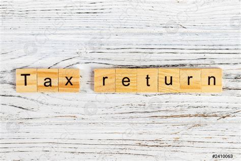 Tax Return Word Made With Wooden Blocks Concept Stock Photo