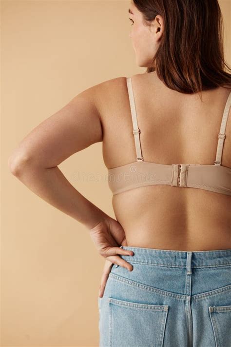 Plus Size Woman Back View Of Happy Full Figured Woman Posing In Beige Lingerie Stock Image