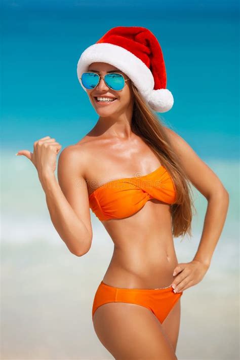 Maiden In Orange Bikini And Hat Of Santa Claus Stock Photo Image Of Relax Blue