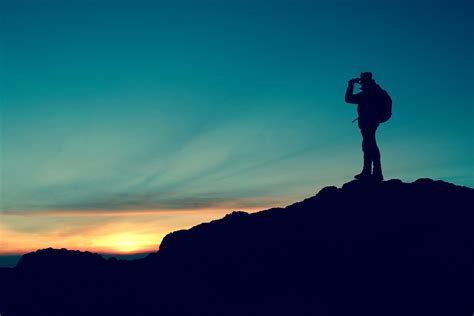 Panoramic Photography Of Man Standing On Mountain During Golden Hour Hd