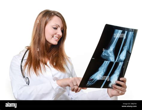 Female Doctor With X Ray In Hand Over A White Background Stock Photo