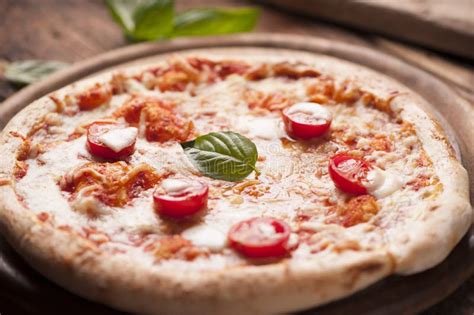 Pizza With Mozzarella Cheese And Basil Leaves Stock Photo Image Of