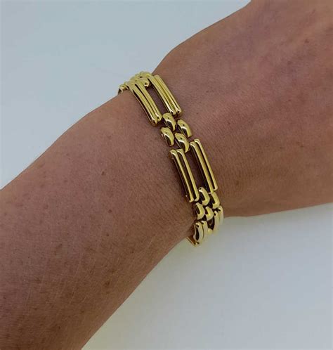 An 18ct Gold Stylized Gate Bracelet In Cheffins Fine Art