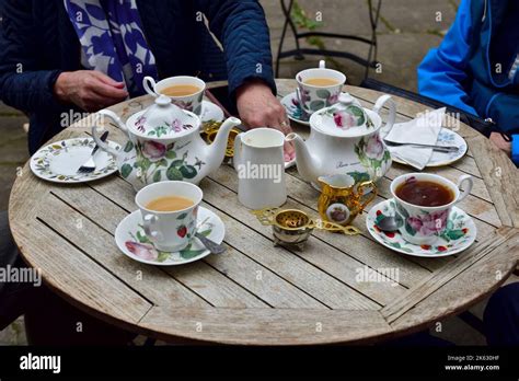 Proper Traditional Tea Service Served On An Outdoor Table In Historic