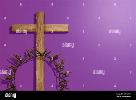 Christian Cross And Crown Of Thorns With Colored Background Stock Photo