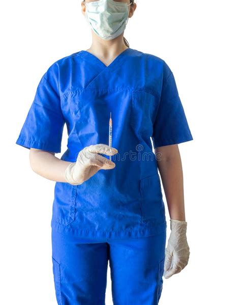 Unknown Young Female Doctor In Blue Medical Uniform Holding A Sy Stock