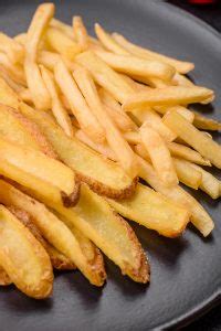 Deliciosas Batatas Fritas Crocantes Sal E Especiarias Em Um Fundo