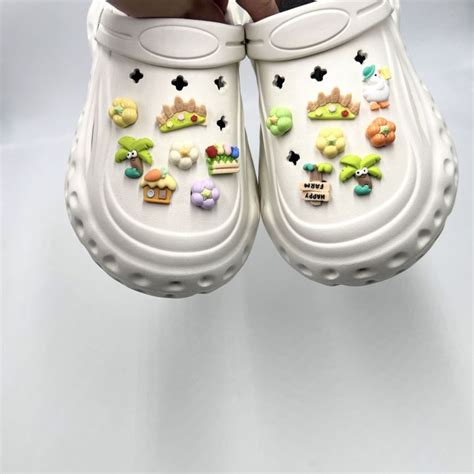 หัวเข็มขัด Crocs Jibbilz 14ชิ้นเซ็ตอุปกรณ์เสริมรองเท้ามีเสน่ห์หัวเข็ม