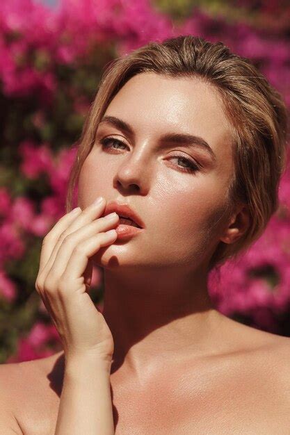 Premium Photo Beautiful Blonde Woman With Smooth Skin And Natural Makeup As She Poses Against