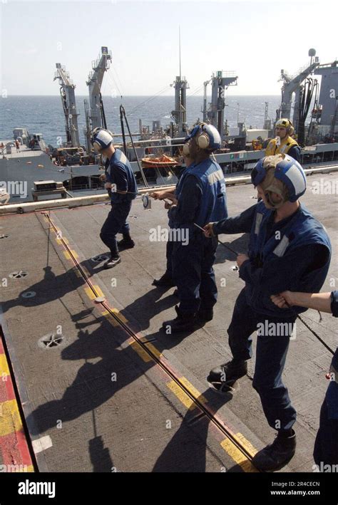 US Navy Crew Members Aboard The Nuclear Powered Aircraft Carrier USS