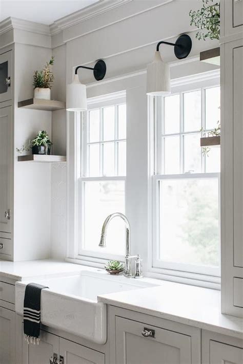 Vintage Fluted Sconces Over Farm Sink Transitional Kitchen