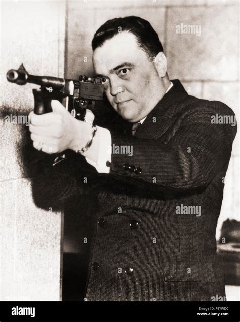 1930s J EDGAR HOOVER DIRECTOR OF FBI HOLDING AIMING THOMPSON