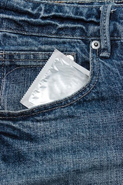 Premium Photo Condoms In Jeans Pocket For Safe Sex