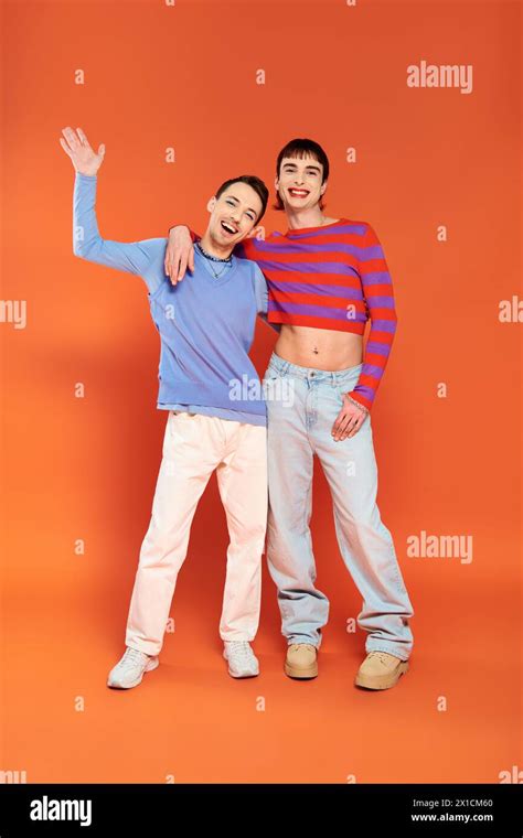 Joyous Attractive Gay Friends With Vivid Makeup Posing Together On