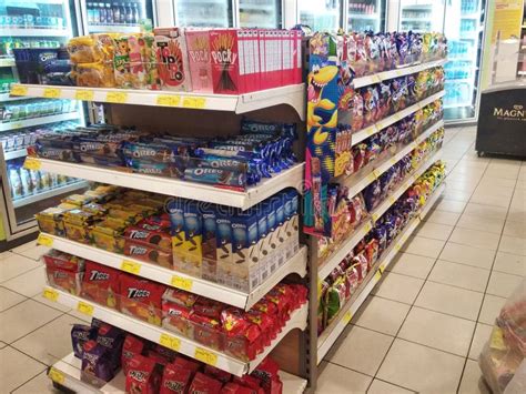 Packed Miscellaneous Junk Foods And Snacks On Rack And Display On The